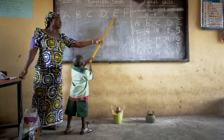 Ladi T. Danlami with schoolchildren in Yangoji Primary School where she is a teacher, Abuja State, Nigeria on the 4th October, 2012. 