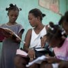 Nadege Auguste teaches her daughters at home. Access to education is a huge challenge in Haiti