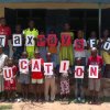 Pupils at the Activista Free Holiday Coaching Lesson in Tionsha community in Benue State Nigeria taking action as part of the Tax Power Campaign 