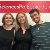 Four people standing in front of a banner reading SciencesPo Ecole de droit